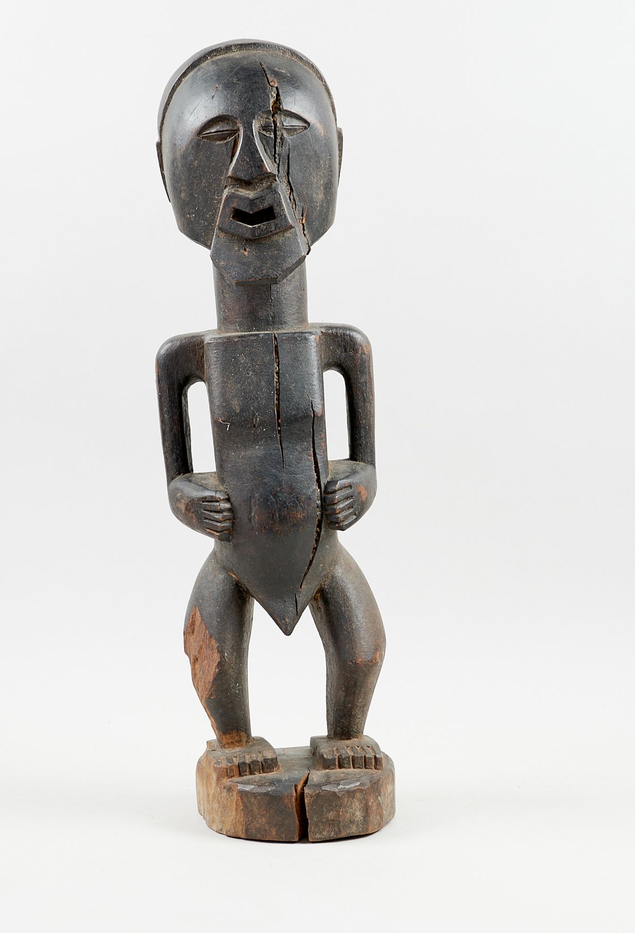 Kunsthandwerk - Afrika - Nkishi-Statue der Songye. - Holz, schwarz gefärbt.