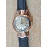 Ladies vintage 9ct gold cased Omega watch with black leather strap