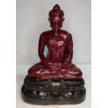 Extremely rare, large, Ruby-Zoisite carved seated Buddha sat on associated black Tschermakite, 40 cm