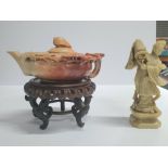 Antique Oriental soapstone carved teapot on a hardwood stand together with another antique soapstone