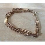 Unusual figure of eight, fold over barred bracelet in 9ct rose gold, 20 grams