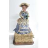 Late 19thC French musical automaton doll with elevating arms and rotating head attributed to