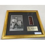 Framed Elvis memorabilia of film slide