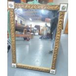 Early 20thC ornate mirror with gesso frame with each corner containing an enamelled plaque depicting