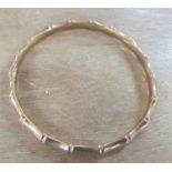 Large 9ct rose gold bangle with bamboo decoration, 14.8 grams