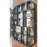 Swarovski small crystal glass figurines and animals in a display cabinet