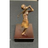 Small unmarked modernist bronze of a lady golfer on a wooden plinth