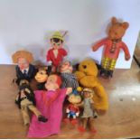 Collection of 1960s to 1990s puppets and toy figures including a Rupert Rupert Bear, a Walt Disney