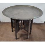 Brass engraved top Moorish table with ornate wooden base 71cm diameter