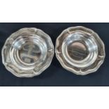 Pair of large, mid 20thC silvered metal dishes (2)