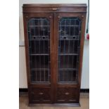 Edwardian stained glass and lead fronted bookcase with inner shelves 93 x 30 x 75 cm