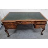 Over-sized 20thC green leather topped desk in the Regency style