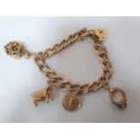 Heavy 9ct gold bracelet with 5 9ct gold charms, 37.5 grams