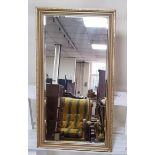 Gold coloured framed mirror