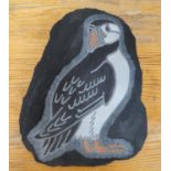 Engraved and coloured bird on slate