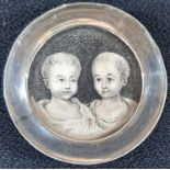 Small circular antique miniature in graphite of twins in an antique circular free standing