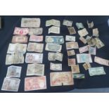 Collection of old, used world bank notes including a number of French francs and an old 100 yuan