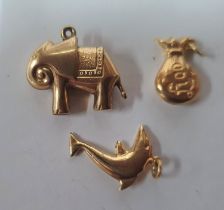 Three various 9ct yellow gold charms (3), 2.4 grams