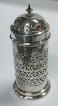 Silver pierced sugar shaker with glass liner 185 grams gross