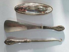 Edwardian ladies silver topped nail file together with a silver handled shoe-horn and a silver