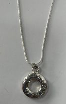 Silver Tiffany & Co pendant on a chain along with bracelet