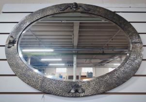 Ornate oval hammered effect mirror