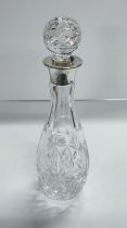 Silver topped cut-glass decanter with stopper