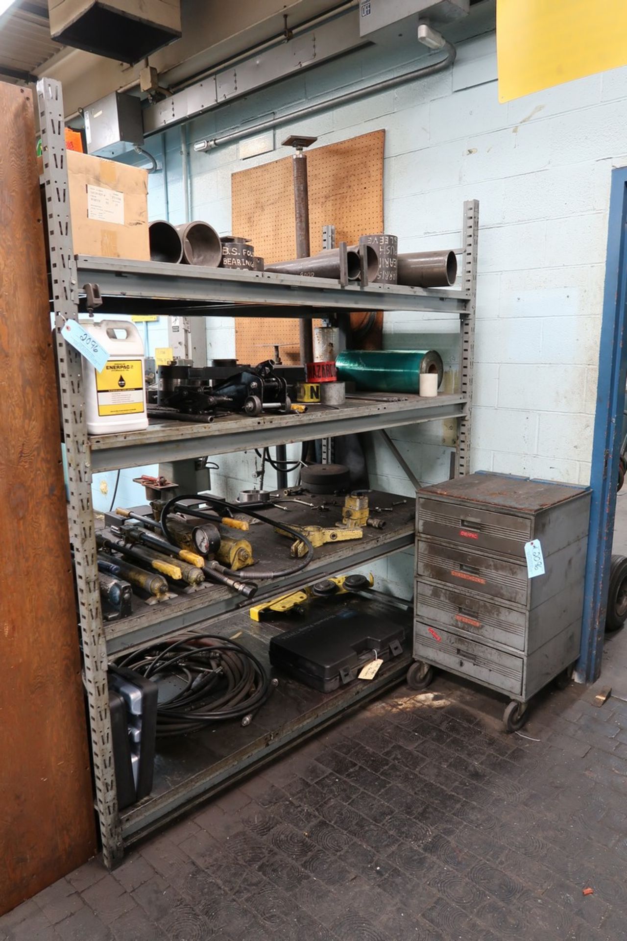 Section of Heavy Duty Adjustable Shelving with Contents of Hydraulic Components