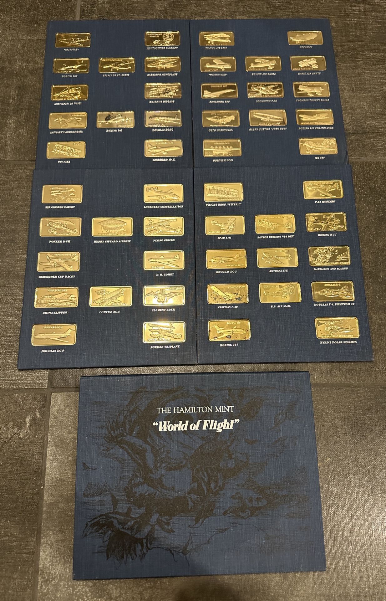 THE HAMILTON MINT WORLD OF FLIGHT 50 ONE OUNCE .999 SILVER PIECES, WITH 24K E.G.P ON TOP