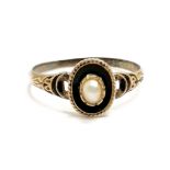 Antique mourning ring in unmarked gold with blue enamel detail and cut pearls to centre in