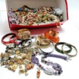 Large quantity of costume jewellery including earrings, bangles and an amethyst necklace etc.