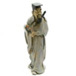 Large Oriental figure of a man carrying a sword & a swish - 47cm high ~ base has been repaired