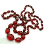 Strand of cherry amber bakelite facetted beads - 86cm & 50g total weight