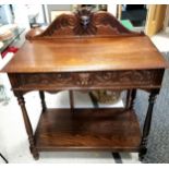 Antique carved oak side table with single drawer and shelf to base with carved upstand and drawer
