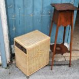 Mahogany torcher/plant stand T/W a wicker storage basket . Torcher has losses and marks to the