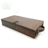 Antique hardwood box with sprung brass catch and leather handle to 1 end & oil staining to