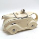 Art Deco cream china car teapot with silver painted detail, bearing registration mark to base 23cm