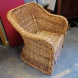 Wicker armchair. In good used condition. 70 cms in width, 68 cms in depth, 82 cms in height.