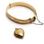9ct gold metal core bangle t/w 9ct front & back heart shaped locket (dent to front) - total weight