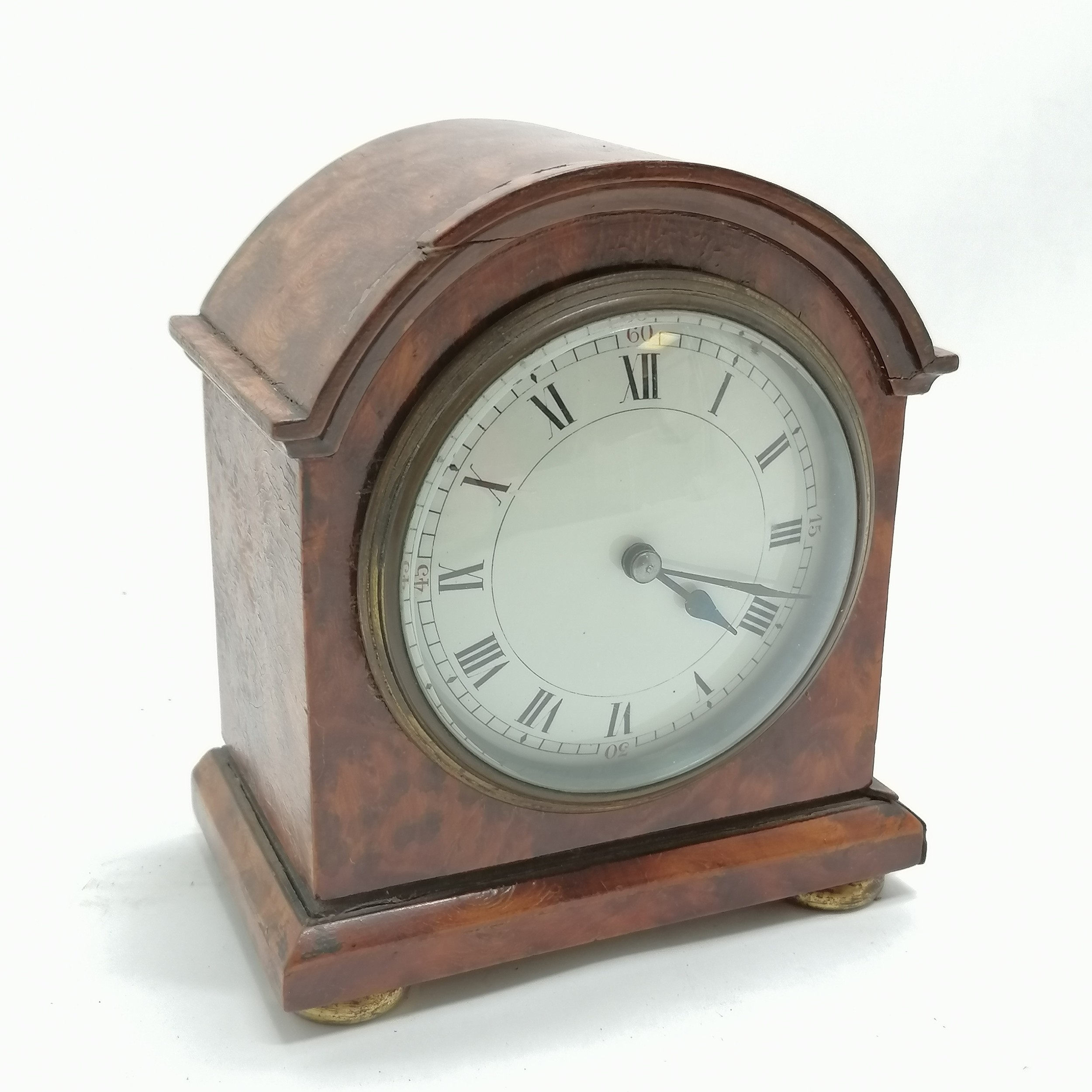 Walnut veneered mantle clock with porcelain dial with key with a French movement - 15cm high and has