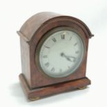 Walnut veneered mantle clock with porcelain dial with key with a French movement - 15cm high and has