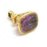 Antique unmarked (tests or 15ct or higher) gold fob with amethyst seal end with Caroline