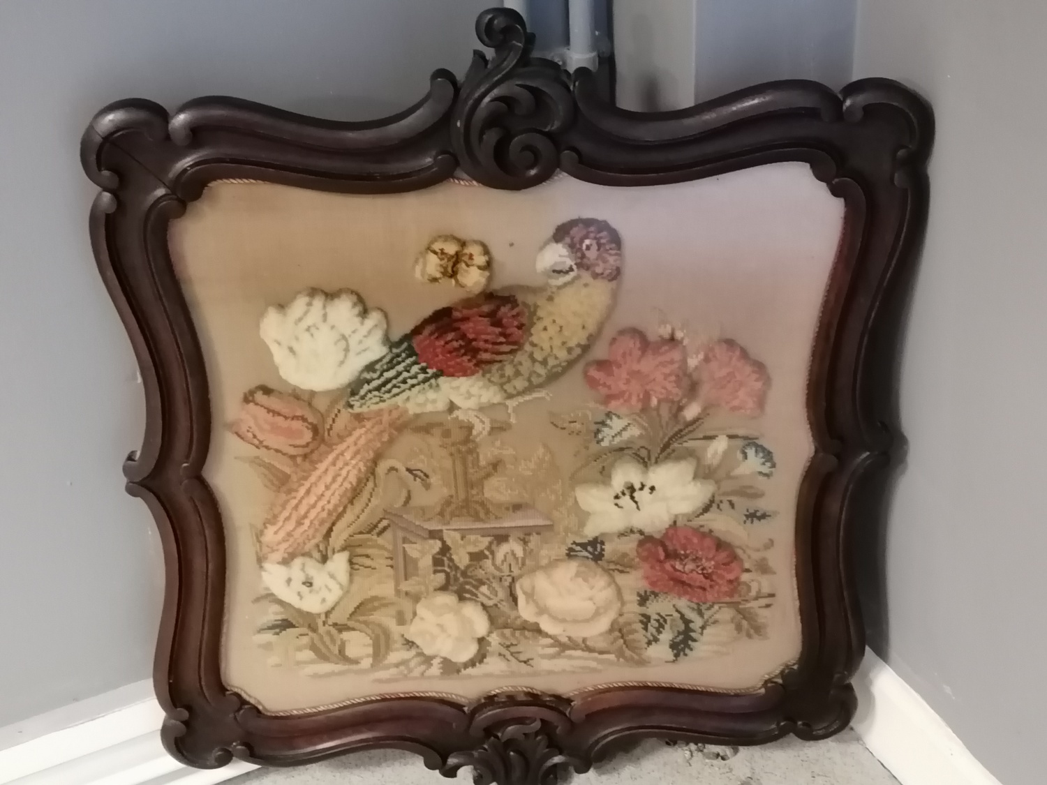 Mahogany carved framed tapestry & stump work picture of a parrot + flowers - 70cm x 59.5cm