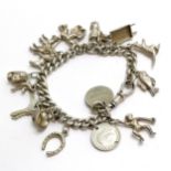 Silver charm bracelet (manufactured from an antique albert chain) inc monkey, wheelbarrow etc -