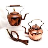 2 copper kettles, one having dents the other having age related ware T/W copper horn.