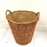 Wicker log basket with hessian lining. 55cm high x 50cm diameter. In good used condition.