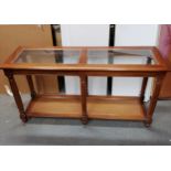 Reproduction glazed top hall table with rattan shelf. in good used condition. 133 cms in length,