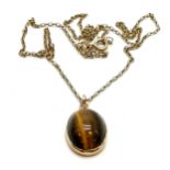 9ct hallmarked gold cabochon tigers eye stone set pendant on 9ct marked gold 50cm chain - 6.8g total
