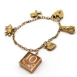 9ct hallmarked gold bracelet with padlock clasp & with Georg Jensen 10/- charm t/w 4 other charms (