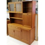 Mid 20th C mahogany G Plan wall unit glazed cupboard and shelving and drinks cupboard to the top and